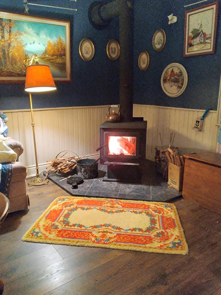 Woodstove glowing in Sara’s living room