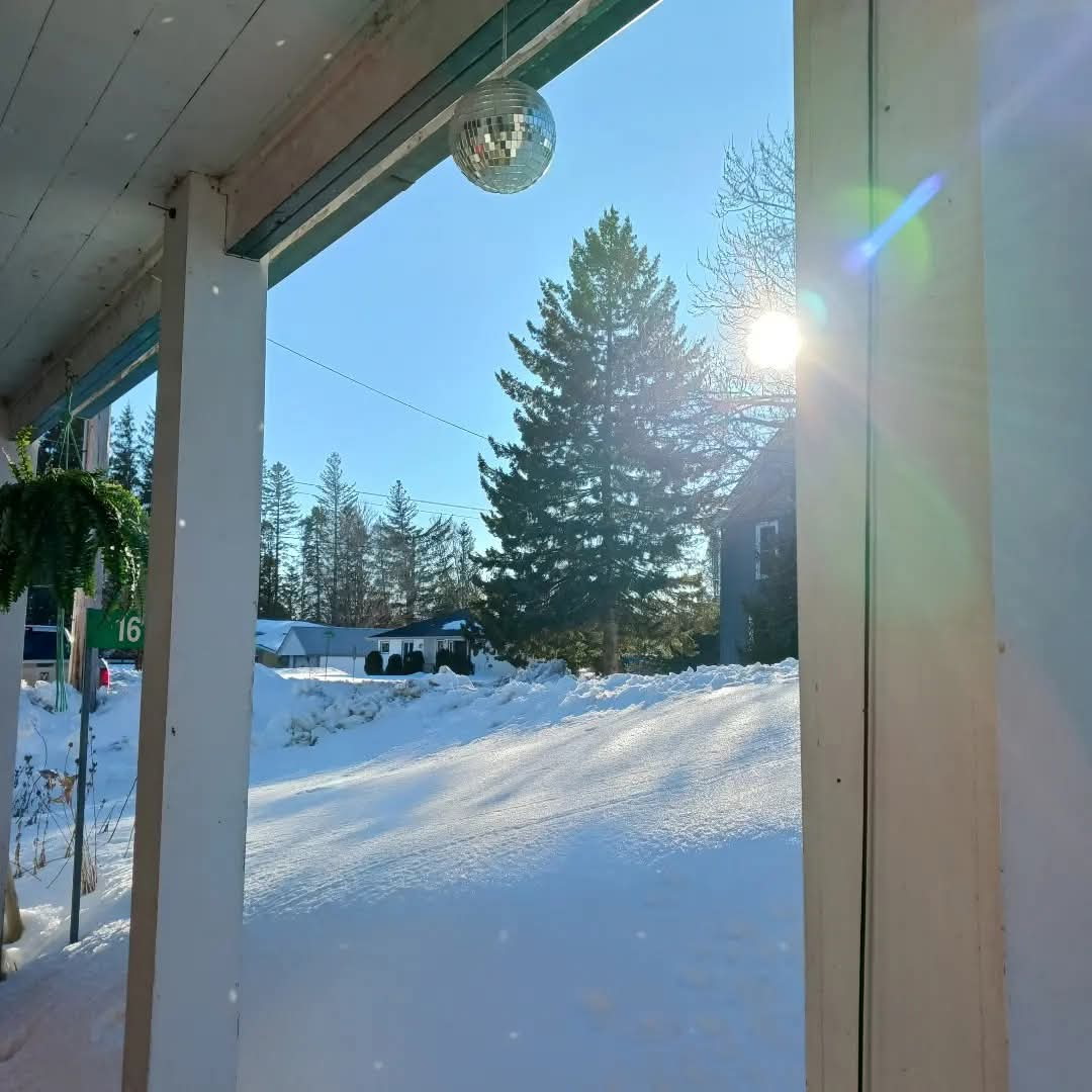 Snowy winter view from the farmhouse porch
